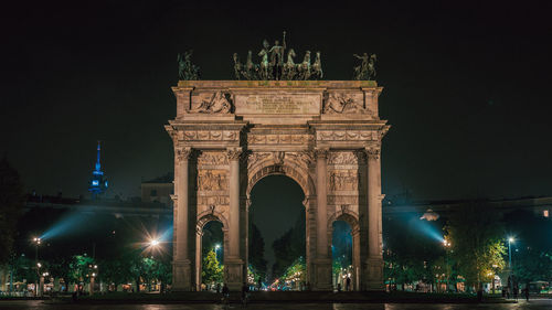 Low angle view of illuminated building at night