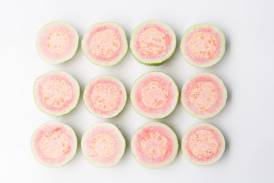 High angle view of candies against white background