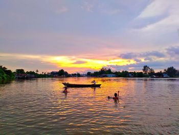 Scenic view of lake against sky during sunset