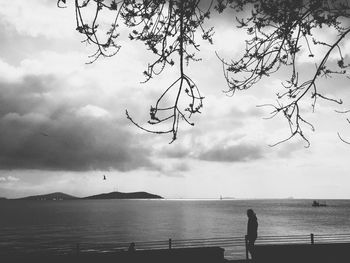 Scenic view of sea against cloudy sky