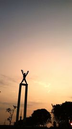 Low angle view of silhouette tree against sky at sunset