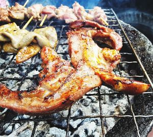 High angle view of meat on barbecue grill