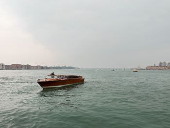 Boat in sea against sky