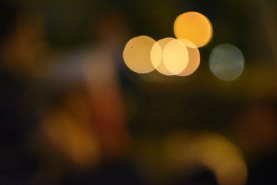 Defocused image of illuminated lights at night
