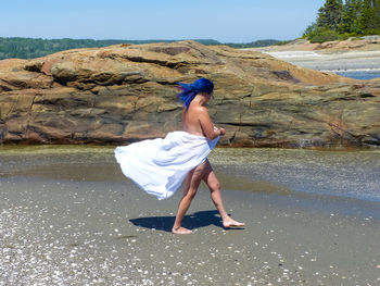 Full length of woman on beach