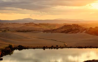 Scenic view of mountains against sky during sunset