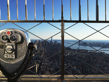 View of cityscape through fence