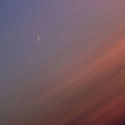 Low angle view of moon against sky at night