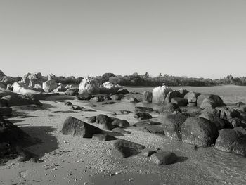 Panoramic view of people on beach against clear sky