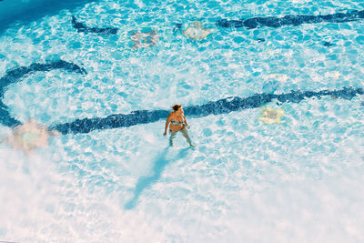 Man swimming in pool