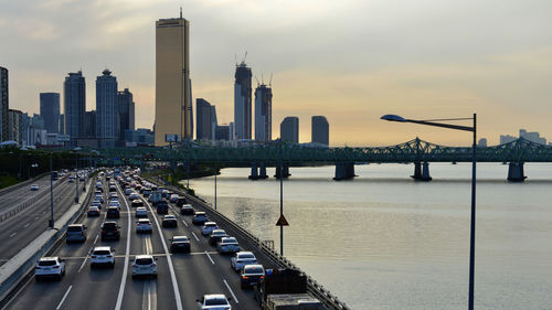 View of bridge over river with city in background