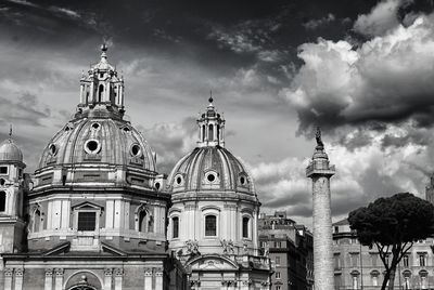 Trajan column and cathedral against sky