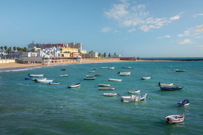 Boats in sea against sky