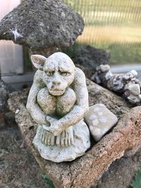 Close-up of statue on rock