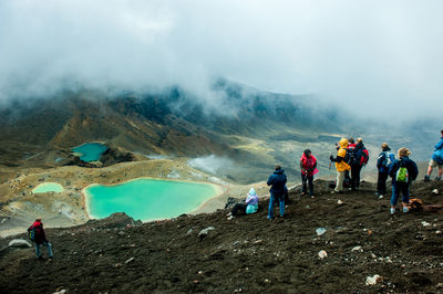 Rear view of hikers on volcanic landscape