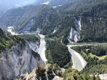 High angle view of river flowing through mountains