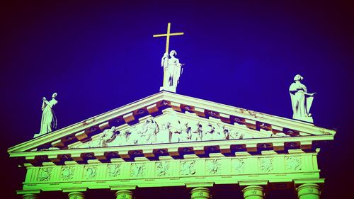 Low angle view of church against blue sky