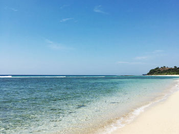 Clear scenic view of sea against blue sky