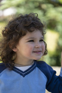 Close-up portrait of cute girl looking away