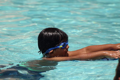 Portrait of woman swimming in pool