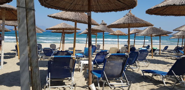 Lounge chairs and parasols on beach