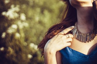 Cropped image of woman wearing necklace