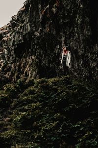 Woman standing on rock