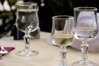 Water and wine in glass on table