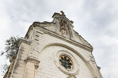 Low angle view of old building against sky