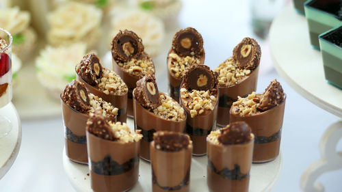 A variety of delicious desserts, cakes with chocolate and nuts. festive decor, sweet bar