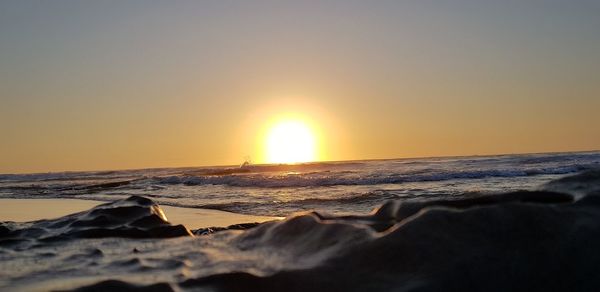 Scenic view of sea against sky during sunset