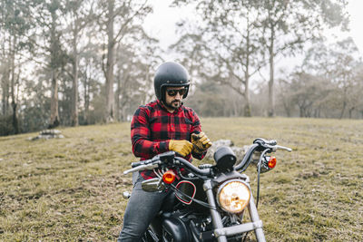 Full length of a man riding motorcycle