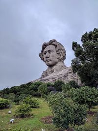 Low angle view of statue against sky