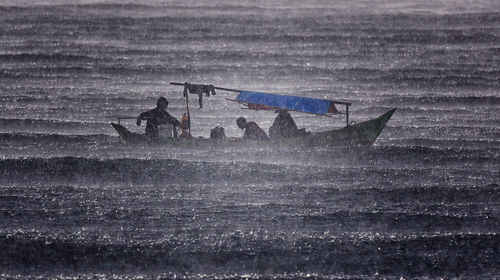 Men on boat in water