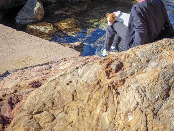 Side view of man on rock