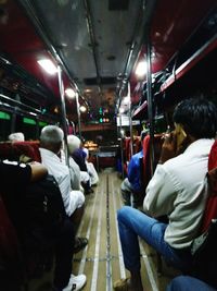 Rear view of people sitting in bus