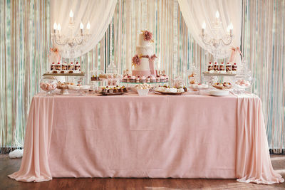 Candy bar and wedding cake. table with sweets, buffet with cupcakes, candies, dessert