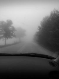 Road passing through foggy weather