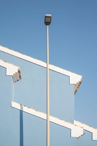 Low angle view of building against blue sky