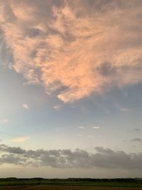 Scenic view of field against sky during sunset