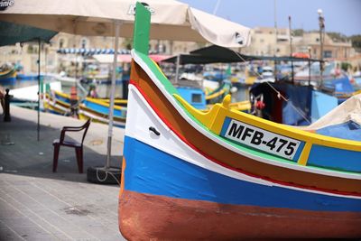 Close-up of sailboats moored on beach