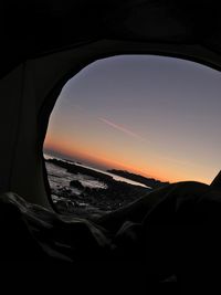 Scenic view of sunset seen through car windshield