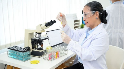 Female dentist working in laboratory