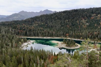 Scenic view of lake and mountains against sky