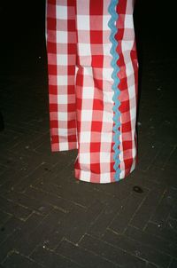 Low section of woman standing on tiled floor