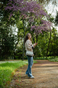 Full length of woman standing on field