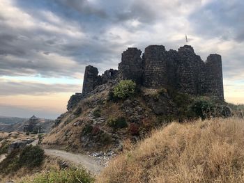 Old ruin building against cloudy sky