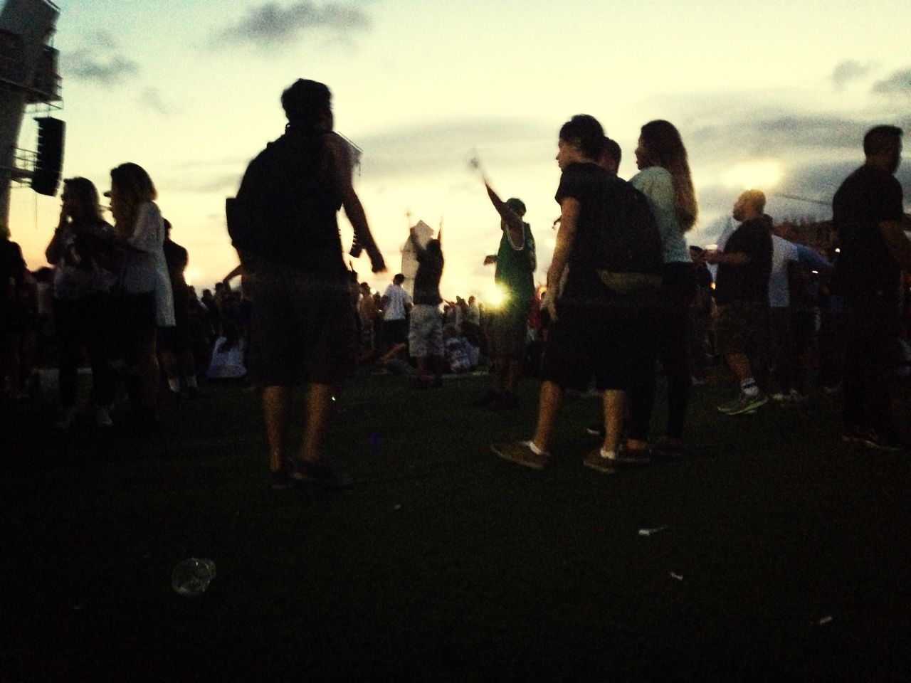 large group of people, men, silhouette, lifestyles, person, togetherness, leisure activity, medium group of people, sky, mixed age range, crowd, group of people, standing, cloud - sky, walking, outline, sunset, outdoors