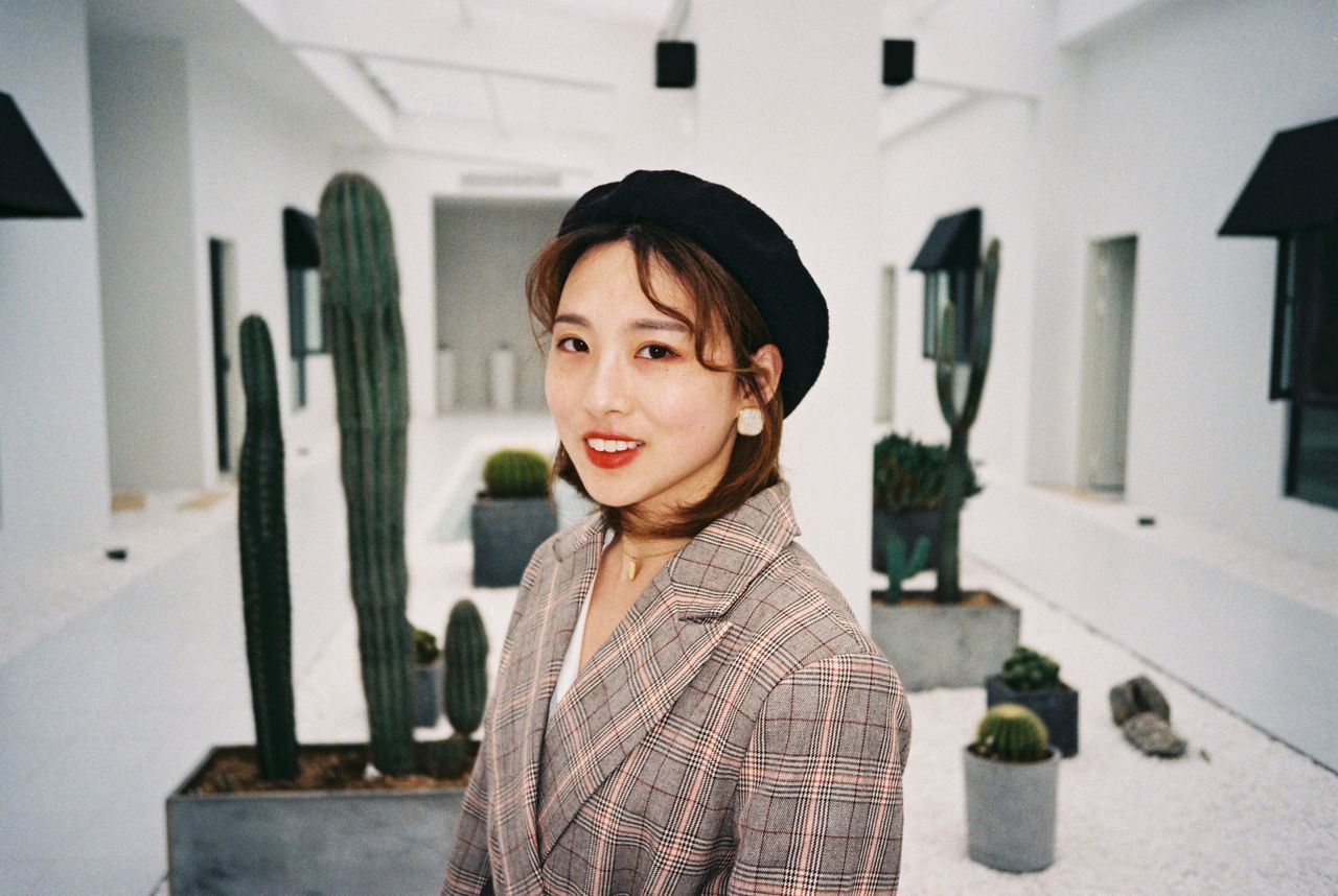 one person, portrait, real people, focus on foreground, indoors, lifestyles, waist up, standing, front view, leisure activity, casual clothing, home interior, looking at camera, headshot, child, black hair, looking, emotion, hairstyle, contemplation, bangs, innocence