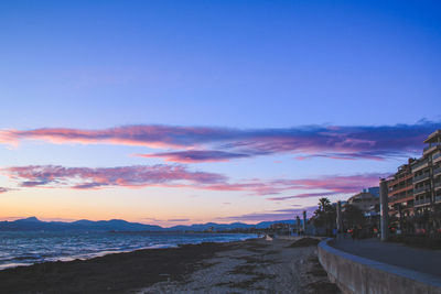 Scenic view of beach against sky during sunset